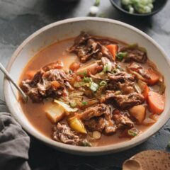 Pressure Cooker Oxtail Soup (An Instant Pot Recipe) - A simplified version using minimal prep and time to cook everything in one pot. No searing or par-boiling required. The oxtails will turn out soft like butter and the soup rich and hearty. Both Instant Pot and stovetop pressure cooker methods are included. {Gluten-Free}
