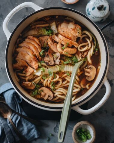 Chicken udon soup in a pot