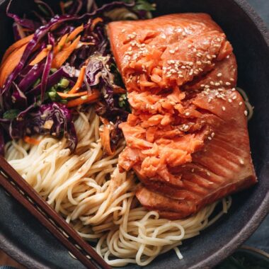 Noodles with flaky salmon on top