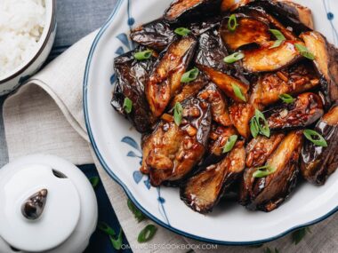 Chinese eggplant in garlic sauce served in a plate