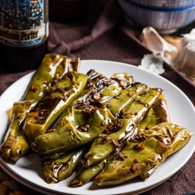 Szechuan Pan Fried Peppers (Tiger Skin Peppers, 虎皮尖椒) - These peppers are pan fried until blistered and tender, then cooked in a sour, savory sauce. A great vegan dish that is hot, flavorful, and appetizing! | omnivorescookbook.com