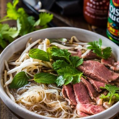 Easy Vietnamese pho noodle soup - Want to get a hearty bowl of Vietnamese pho noodle soup on the table within 30 minutes? Look no further! | omnivorescookbook.com