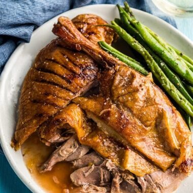 The Best Slow Roast Duck (A recipe from a chef) - The duck is stuffed with citrus, then slow cooked until the meat is falling off the bones and the skin perfectly crisped. | omnivorescookbook.com