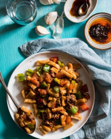 Ding Ding Chao Mian (丁丁炒面) - A hearty fried noodle dish that is cooked with a scrumptious tomato sauce with lamb and peppers. Fast to cook and bold in flavor. A must-have for Xinjiang food lovers.