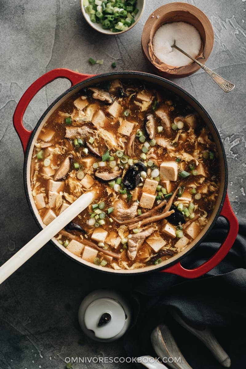 Hot and Sour Soup (酸辣汤) - Authentic Chinese restaurant-style hot and sour soup made easy. The hearty broth is loaded with veggies and is so satisfying and healthy. The recipe includes notes on how to tweak the soup into a vegetarian one and to use whatever veggies you have on hand. #takeout #recipes #traditional Restaurant style hot and sour soup
