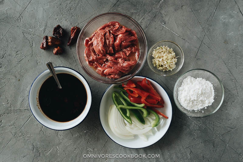 Easy Szechuan Beef Stir Fry - Tender crispy beef cooked in a bold sweet sour spicy sauce with peppers and onions. Learn how to make the richest sauce and create crispy beef without deep-frying. {Gluten-free adaptable} Szechuan beef stir fry ingredients