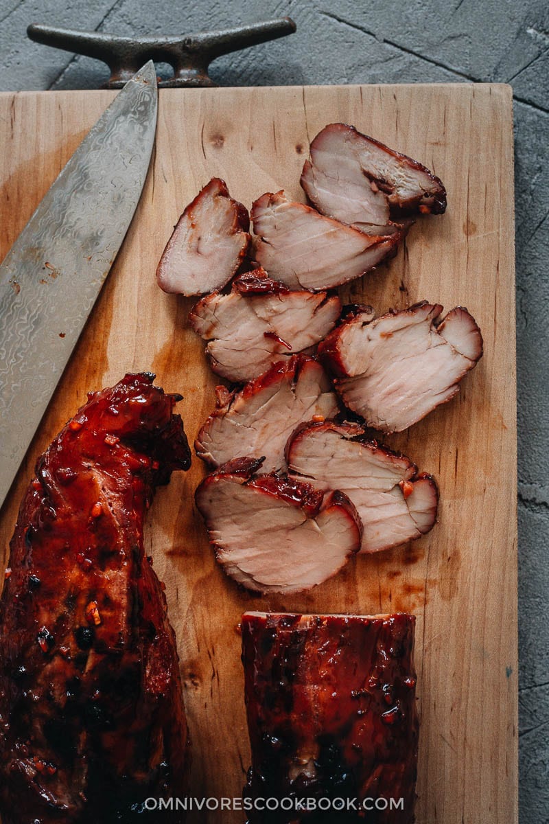 Char Siu (Chinese BBQ Pork, 叉烧肉) - The only char siu recipe you need to make juicy flavorful pork with a sweet glossy glaze, just like you’d get at a Cantonese restaurant. {Gluten-Free adaptable} Sliced Chinese BBQ pork on cutting board