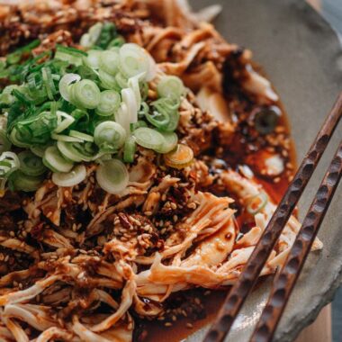 Sichuan-style shredded chicken in red oil close-up