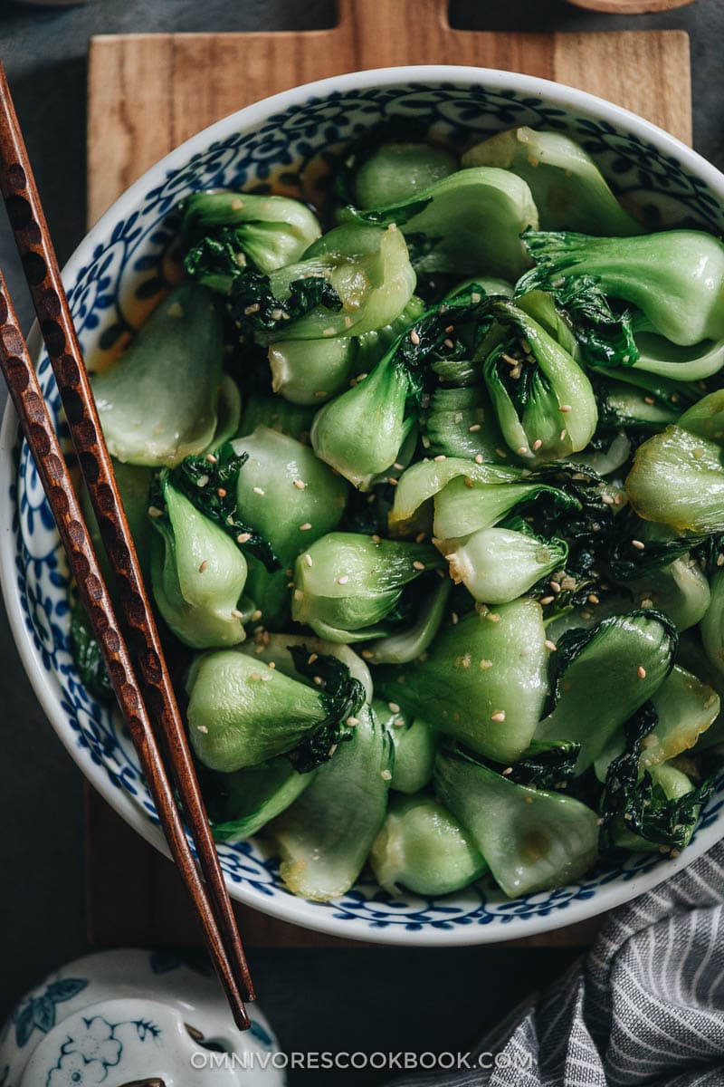 4-Ingredient Baby Bok Choy Stir Fry | Pair this quick and easy side dish with your favorite main and some steamed rice to complete a nutritious meal. This dish takes 15 minutes to whip together. The baby bok choy is cooked until tender, then soaked with a garlicky sauce that’s savory and lightly sweet. It’s such a great way to enjoy vegetables. {Vegan, Gluten-Free Adaptable} Baby bok choy stir fry close-up