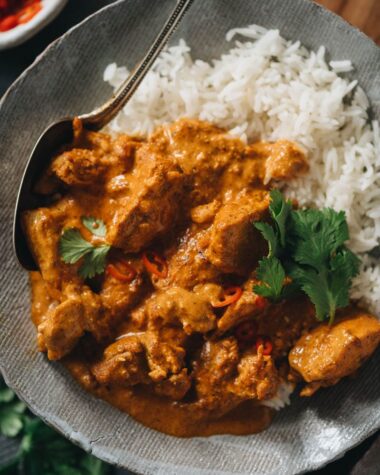Butter chicken served over rice close-up
