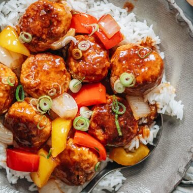 Meatballs with sweet and sour glaze over rice