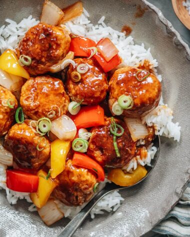 Meatballs with sweet and sour glaze over rice