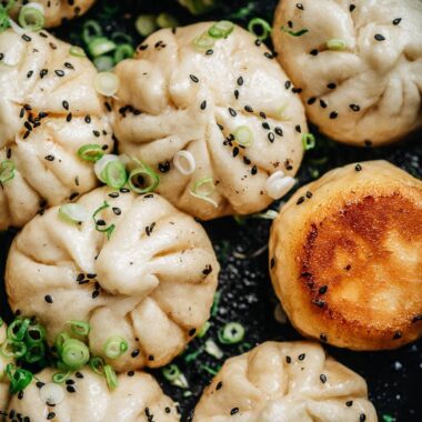 Sheng Jian Bao garnished with sesames and green onion