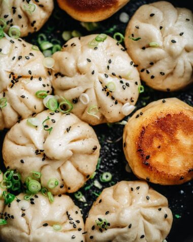 Sheng Jian Bao garnished with sesames and green onion