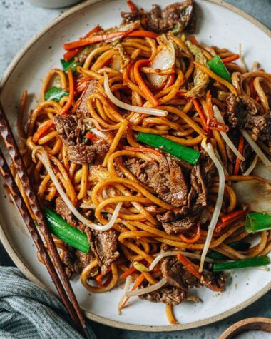 Authentic takeout-style beef lo mein with green onion