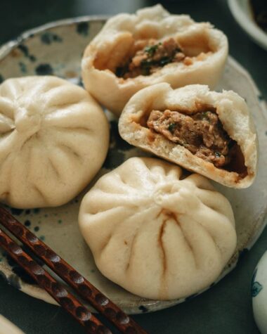 Fluffy steamed buns filled with juicy pork and Chinese chive