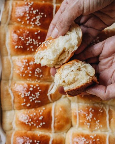 Breaking apart a coconut bun