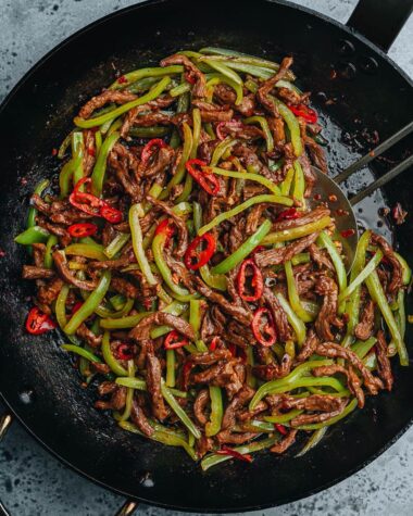 Chinese shredded beef and pepper stir fry in a pan