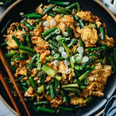 Stir fried garlic scape with scrambled eggs close up