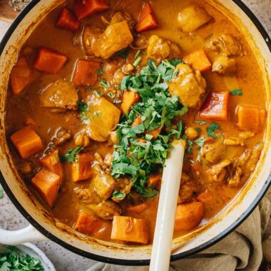 Chicken sweet potato curry in a pot close up