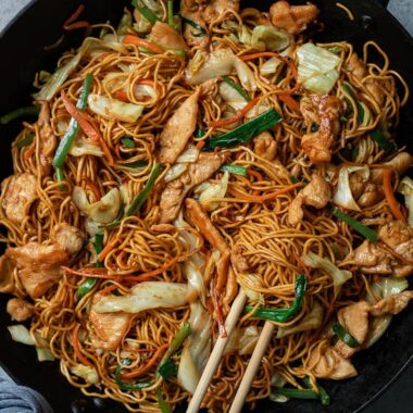 Chicken chow mein in a pan close up