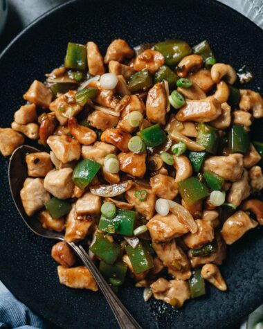 Cashew chicken served in a plate close up
