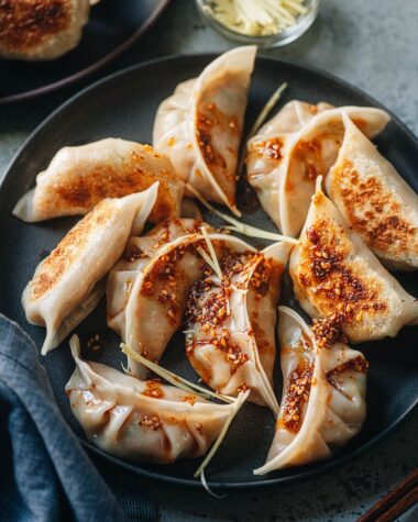 Chinese chicken dumplings served with dipping sauce and chili oil