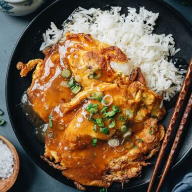 Chinese omelet over white rice with gravy