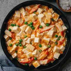 Crab roe tofu made with salted duck egg yolks is a simple and decadent main dish that you can put together in no time. The silky and soft tofu is braised in a savory broth that is bursting with umami. Served it over steamed rice for a satisfying meal in under 30 minutes. {Gluten-Free}