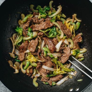 Stir fried beef and celery in a wok