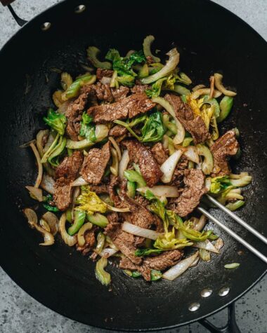 Stir fried beef and celery in a wok