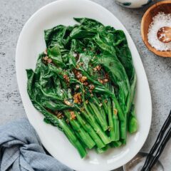 A super simple Choy Sum recipe that uses 5 ingredients to create a scrumptious side dish in 20 minutes. The choy sum is blanched until tender, then drizzled with a garlicky sauce that is savory and lightly sweet. It is a perfect dish to add nutrition and vibrant color to your dinner table. {Vegan}