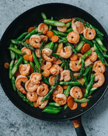 Shrimp and asparagus stir fry in a pan