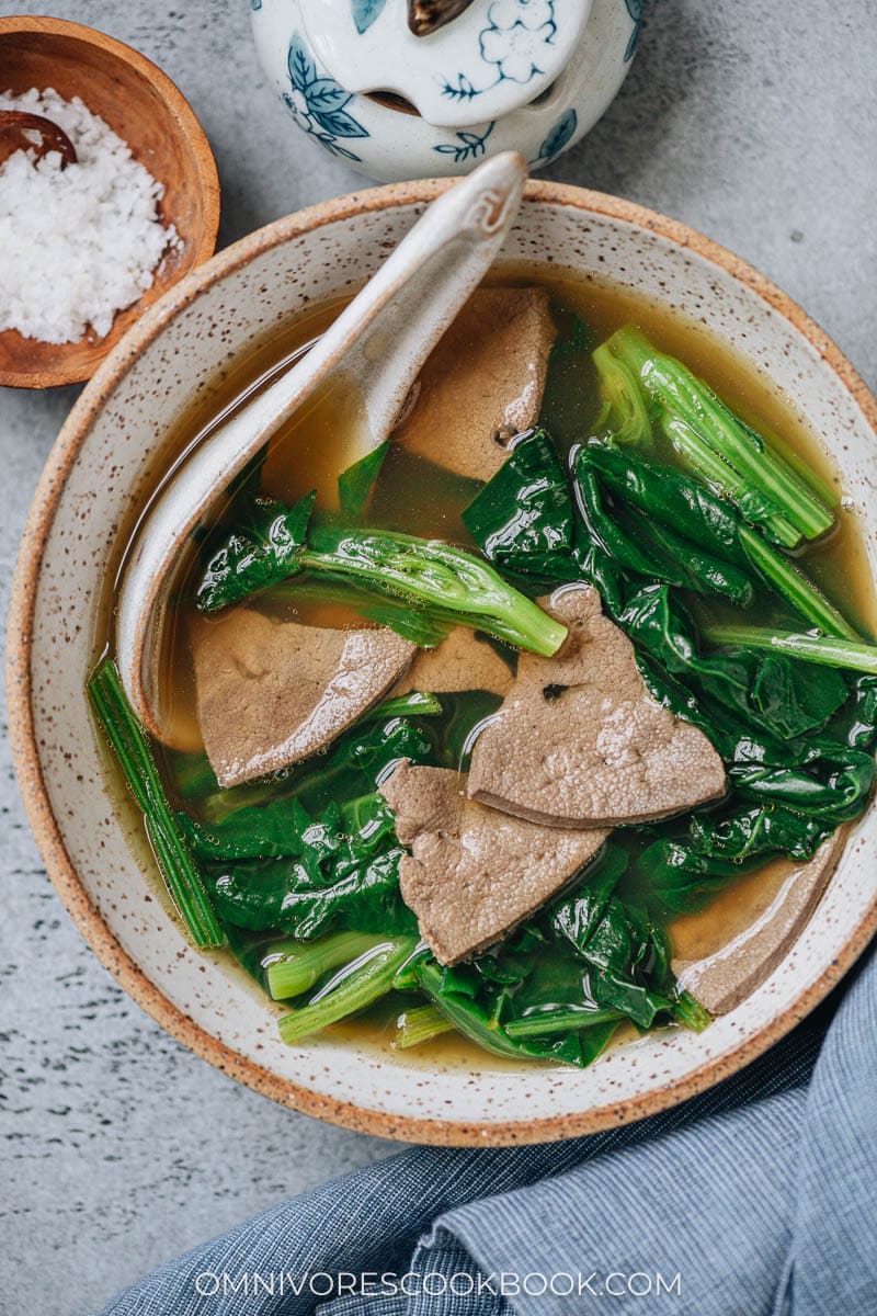 Pork liver soup with spinach close up