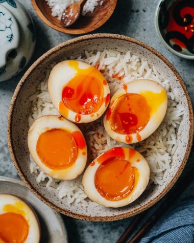 Chinese style marinated eggs over rice