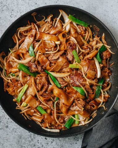 Homemade beef chow fun in a pan