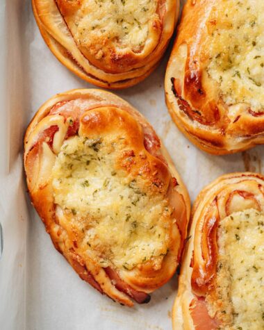 Chinese bakery style ham and cheese buns on a tray