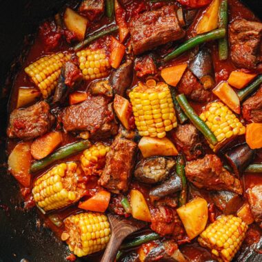 Chinese pork and vegetable stew in a wok close up