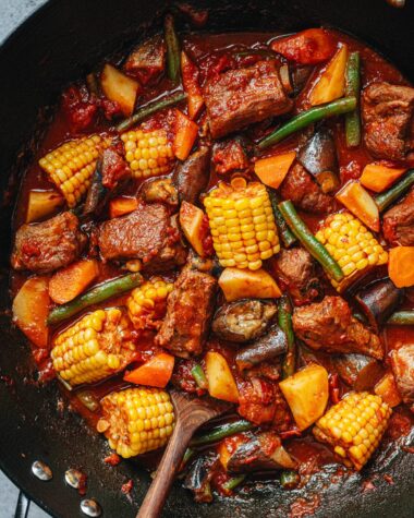 Chinese pork and vegetable stew in a wok close up