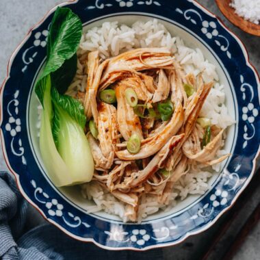 Shredded chicken breast with bok choy over rice