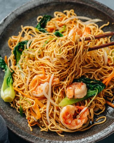 Shrimp chow mein pulled with chopsticks
