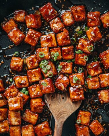 Crispy sesame tofu in a pan close up