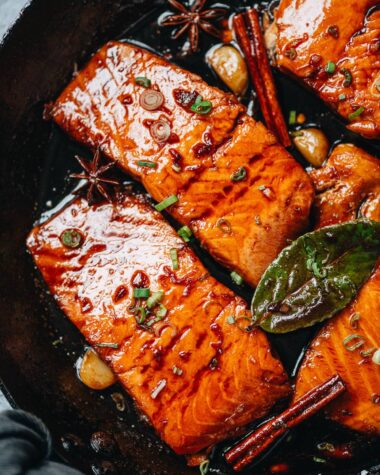 Honey glazed salmon in a pan close up