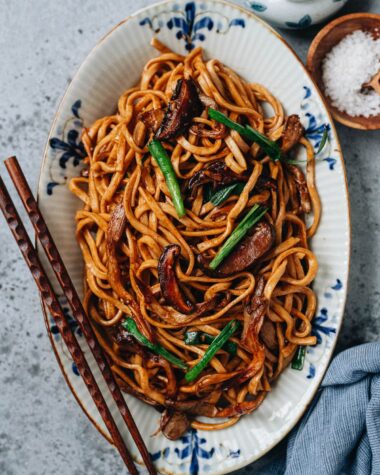 Yi Mein stir fried with mushrooms served in a plate