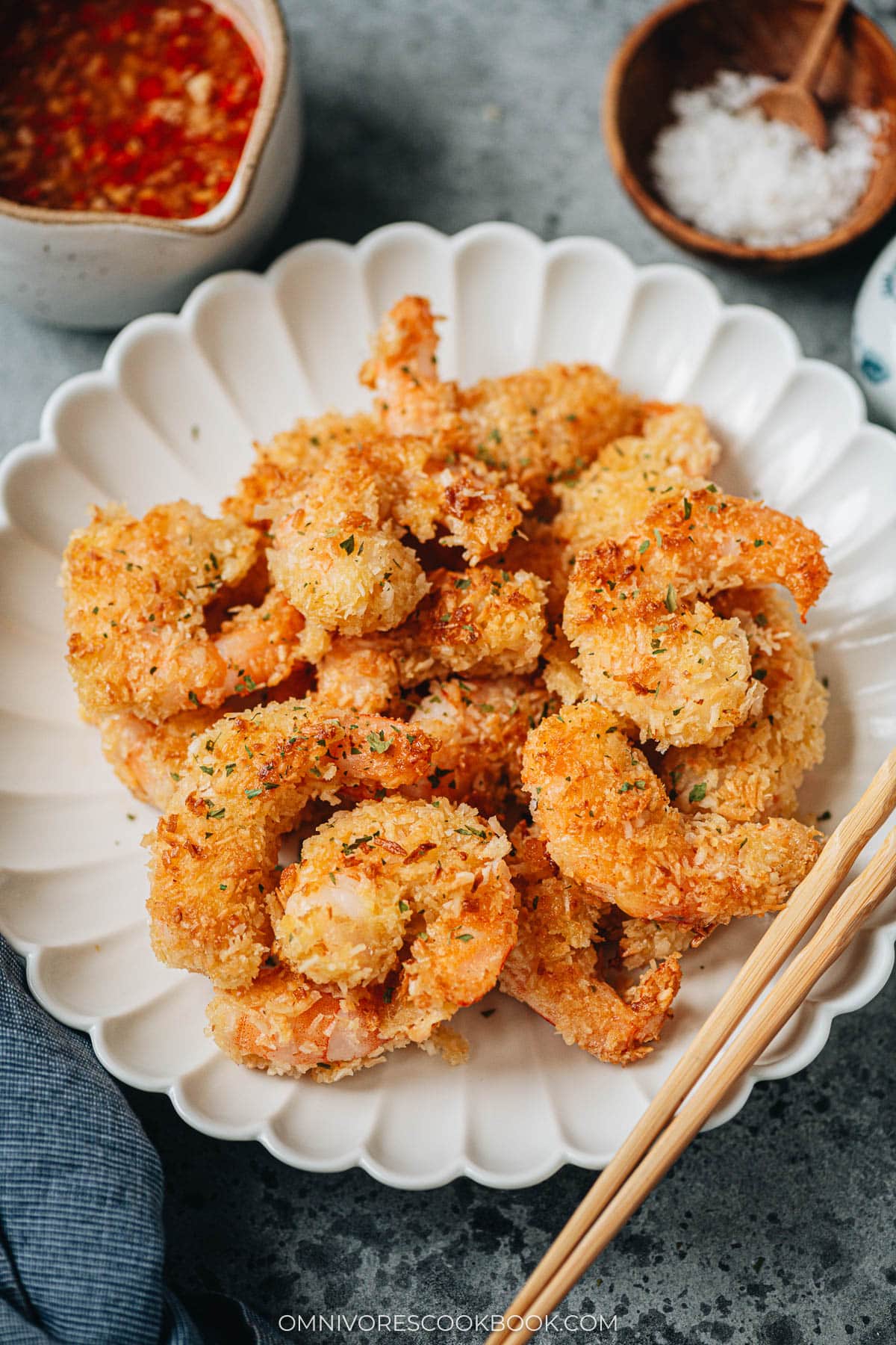 A plate of coconut shrimp served with dipping sauce