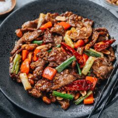 An authentic tasting kung pao beef that features juicy tender beef slices, crisp peppers and crunchy peanuts cooked in a rich sauce that is savory, sour, sweet, and spicy. The combination of flavors and textures makes it a standout in any home-cooked Chinese meal. {Gluten-Free Adaptable}