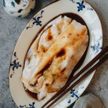 Homemade cheung fun with shrimp filling served on a plate