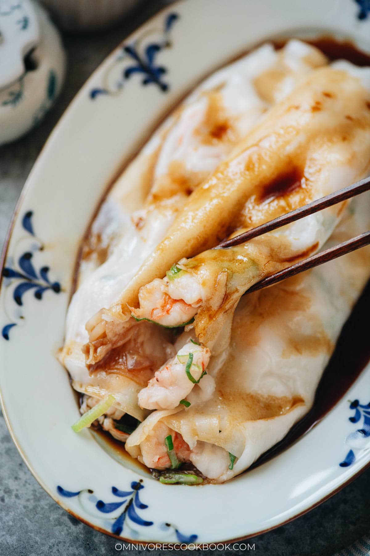 Use a pair of chopsticks to lift shrimp cheung fun