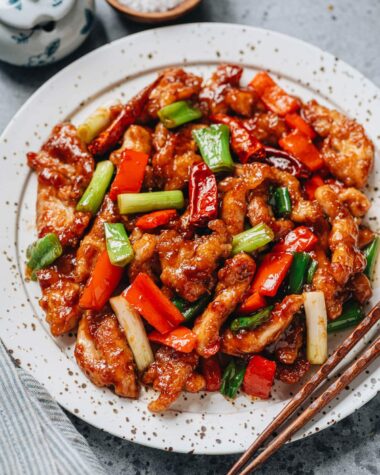 Mongolian chicken with pepper served in a plate close up
