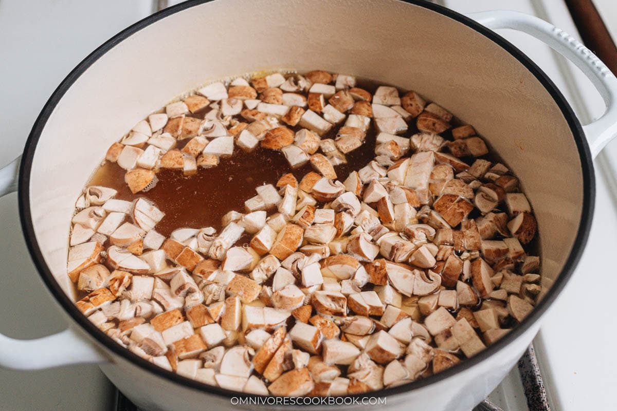 Cook the mushroom and tofu in chicken broth